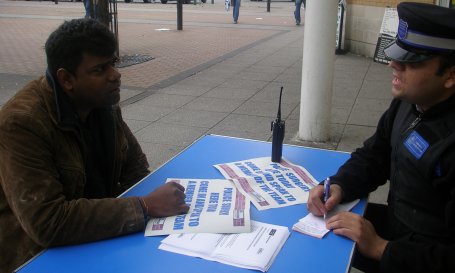 PCSO Azhar Choudhry talks to a local resident