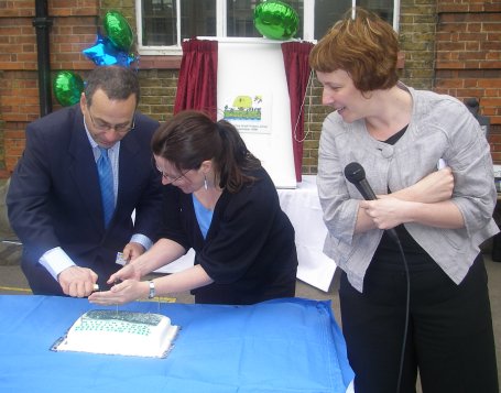 Harry lights candles on the celebratory cake Harry lights candles on the celebratory cake